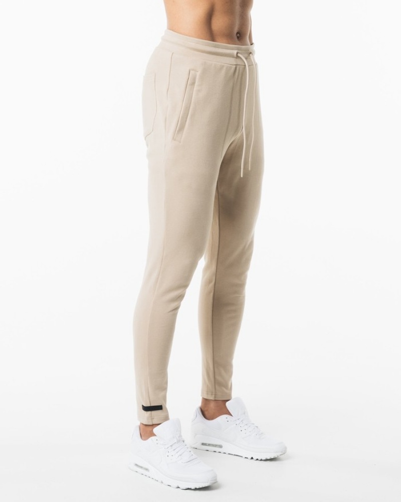 Pantaloni Jogger Barbati Alphalete Identity Bej | 572319-YTN